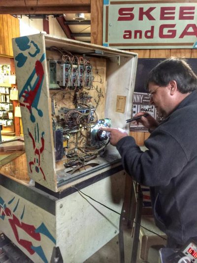 Jim Palson of JT Amusements fixing a pinball machine at Old Sled Works in Duncannon, PA - November 9, 2015